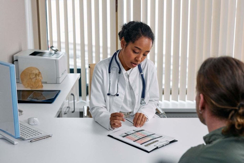 Doctor consulting a patient about treatment options during a medical appointment