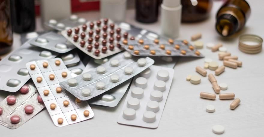 Various modafinil medicines and pills arranged on a table
 